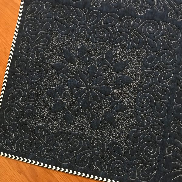 Volume 10 designs, with free-motioned open swirls