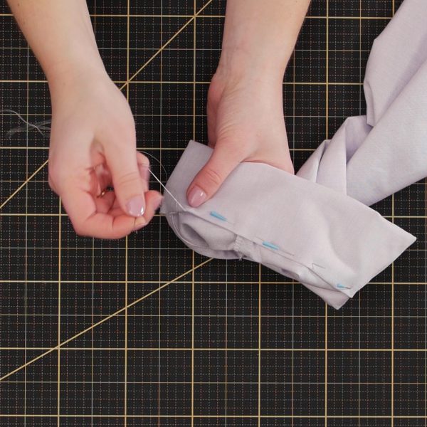 Garment_Sew-along_Part_7_Cuffs_handstitching_cuff_edge_in_place