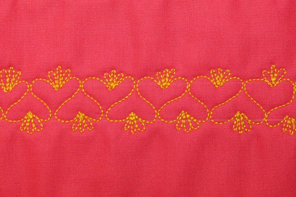 Free Motion Quilt Hearts in a Border - Embellishment on top