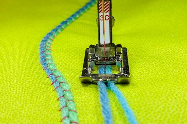 couching two yarns at once