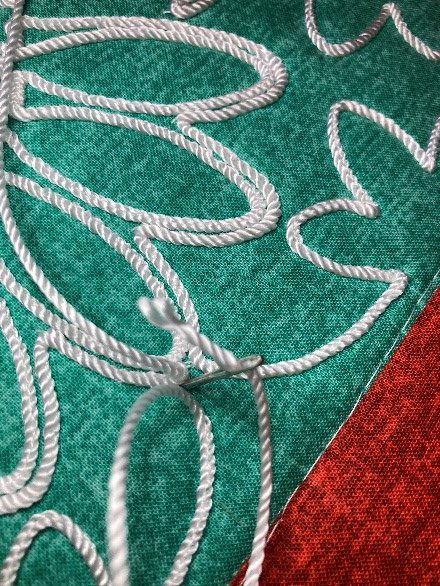 All_Seasons_Couched_Pillow_19_Needle_taking_cording_to_back_BERNINA_WeAllSew_Blog_440x586px