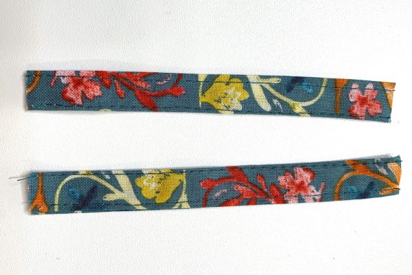 Cut in half creating two straps