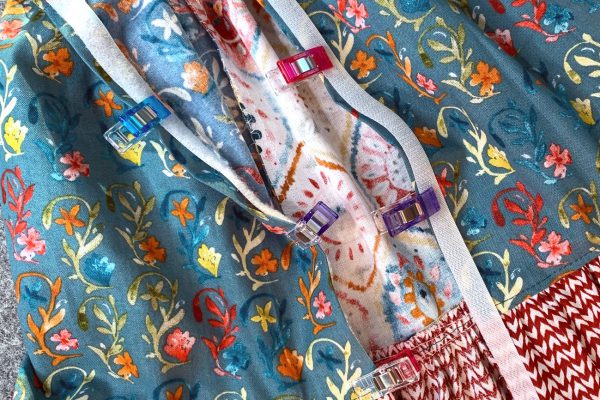 Pin or Clip hook and loop tape to back of dress
