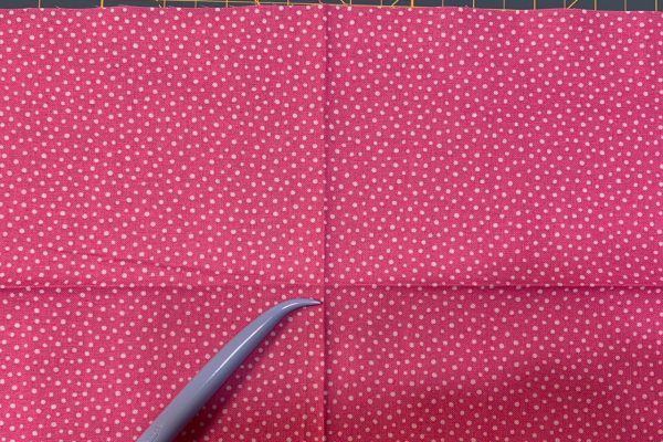 Fold to mark center of bottom band for apron