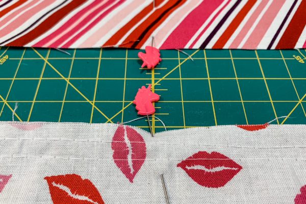 Mark the centers for the waistband and apron with Tula Pink Unicornpins