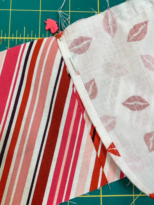 Align side seam of apron to tie and waistband seam