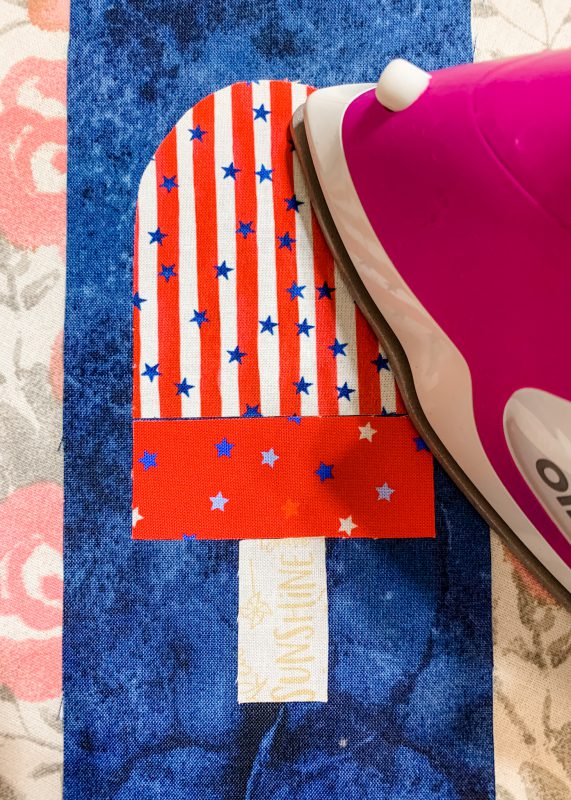 Iron the pieces of the popsicle applique onto the base fabric
