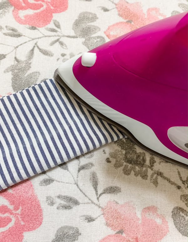 Fold ruffle in half lengthwise wrong sides together and press