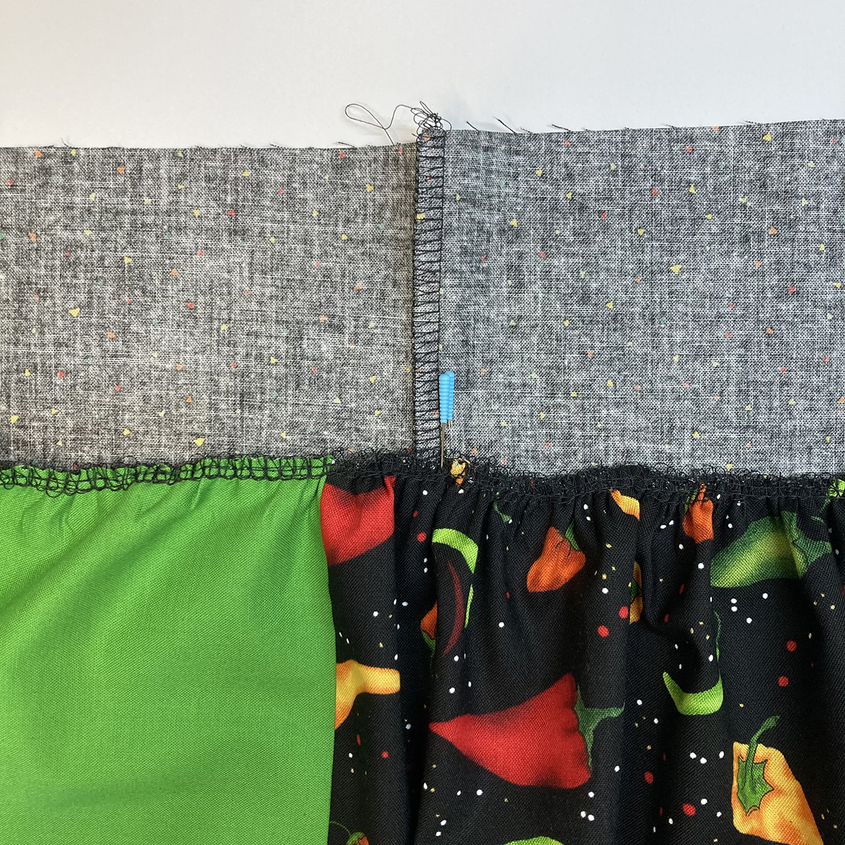 Serging_an_Apron_08_Waistband_pinned_to_apron_BERNINA_WeAllSew_Blog_1200x1200px