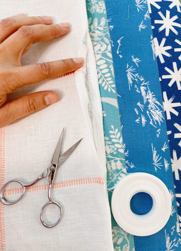 sew a table runner on an overlocker - wonder tape closing