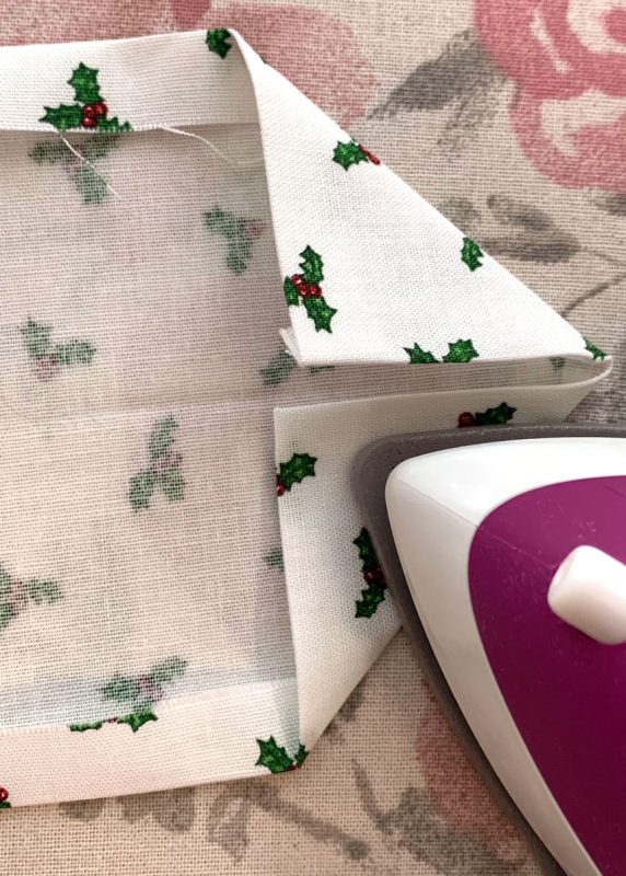 Fold and Press Edges of Tie End