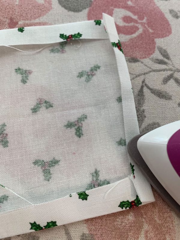 press end of tie toward wrong side