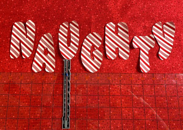 Place the word naughty on the pillow wrap