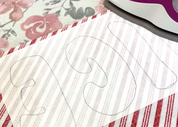 Fuse letters to wrong side of fabric 