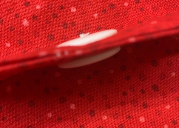 Button sewn on both sides