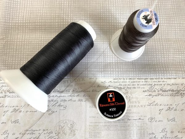 Fine threads for zigzag appliqué. Suggest 60 wt to 100 wt threads such as Superior Bottomline-60 wt, DecoBob-80 wt or Kimono Silk-100 wt