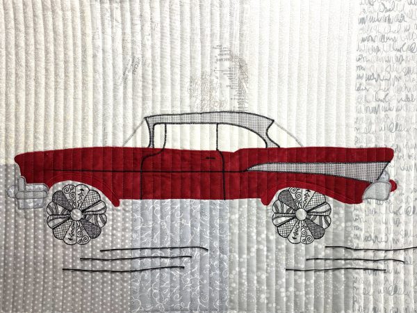 The finished art quilt didn't feel finished so auditioning additional details has begun.