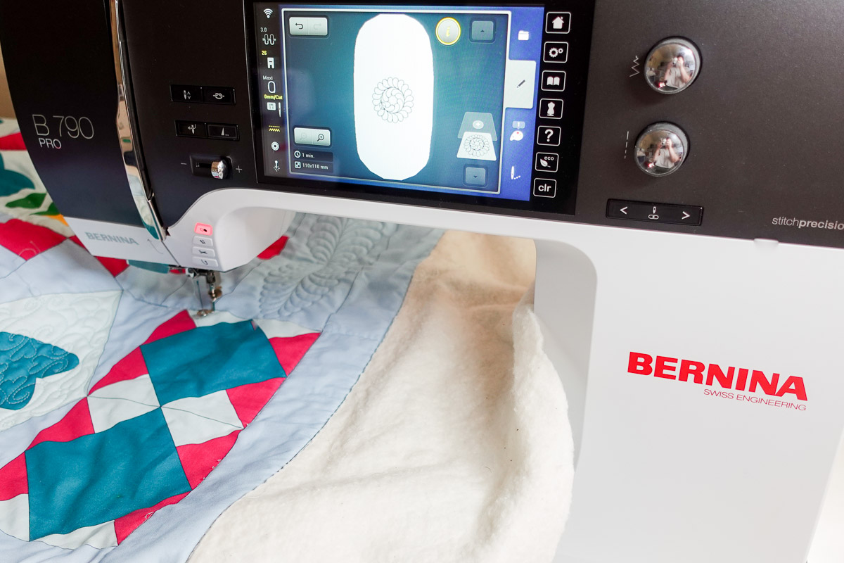 the Jump for Joy quilt is placed on the outer hoop under the needle on the B 790 PRO