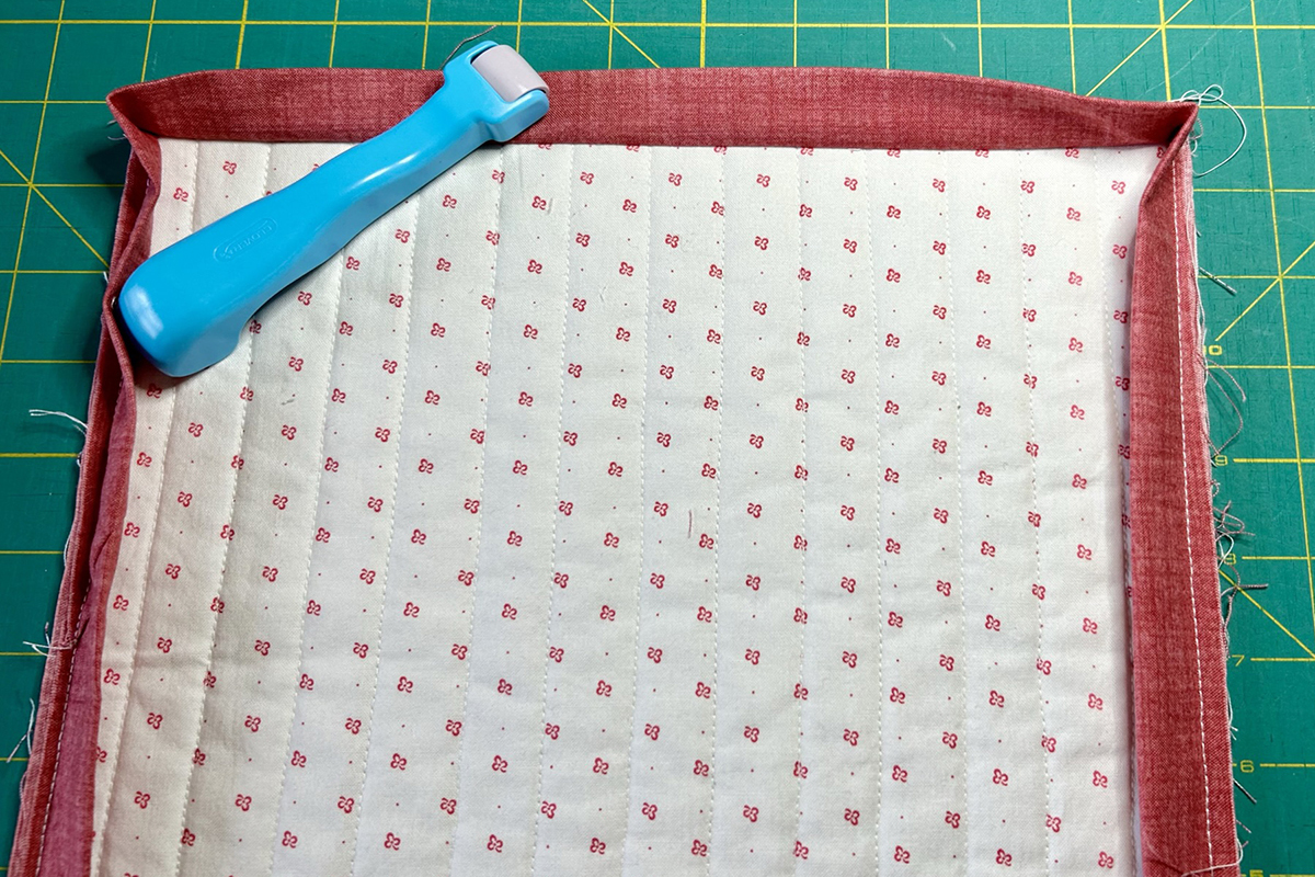 Blindstitch_Binding_03_Pressing_to_Back_BERNINA_WeAllSew_Blog_1200x800px