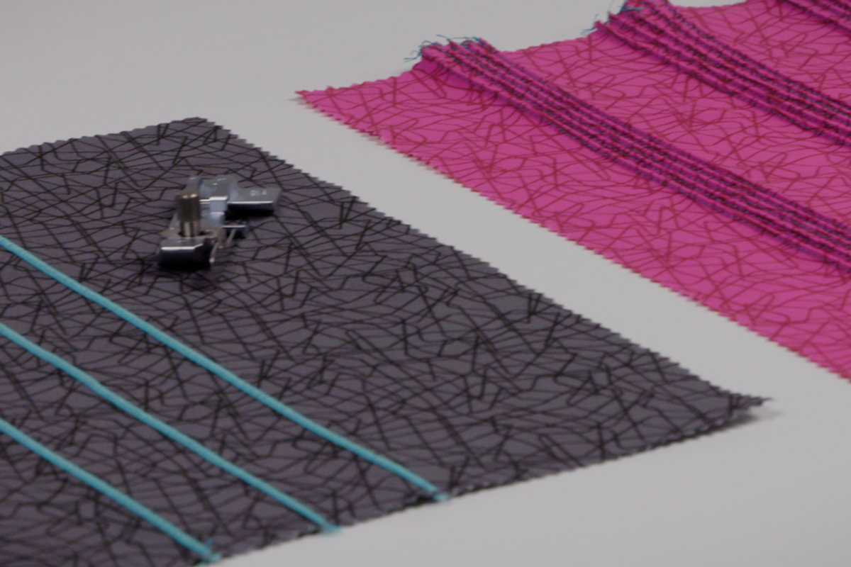 black and pink fabric with pintucks side by side on a table
