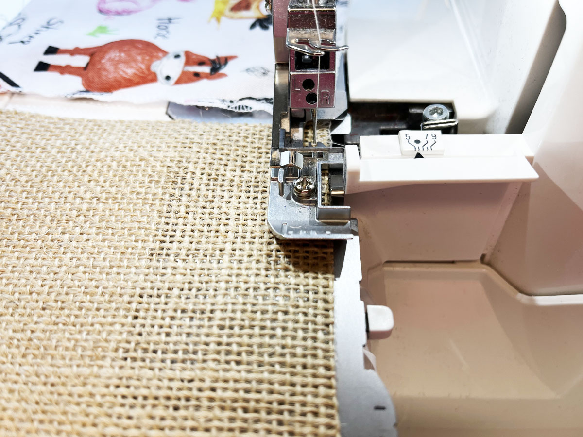Close-up view of BERNINA L 460 serger with edge of squares