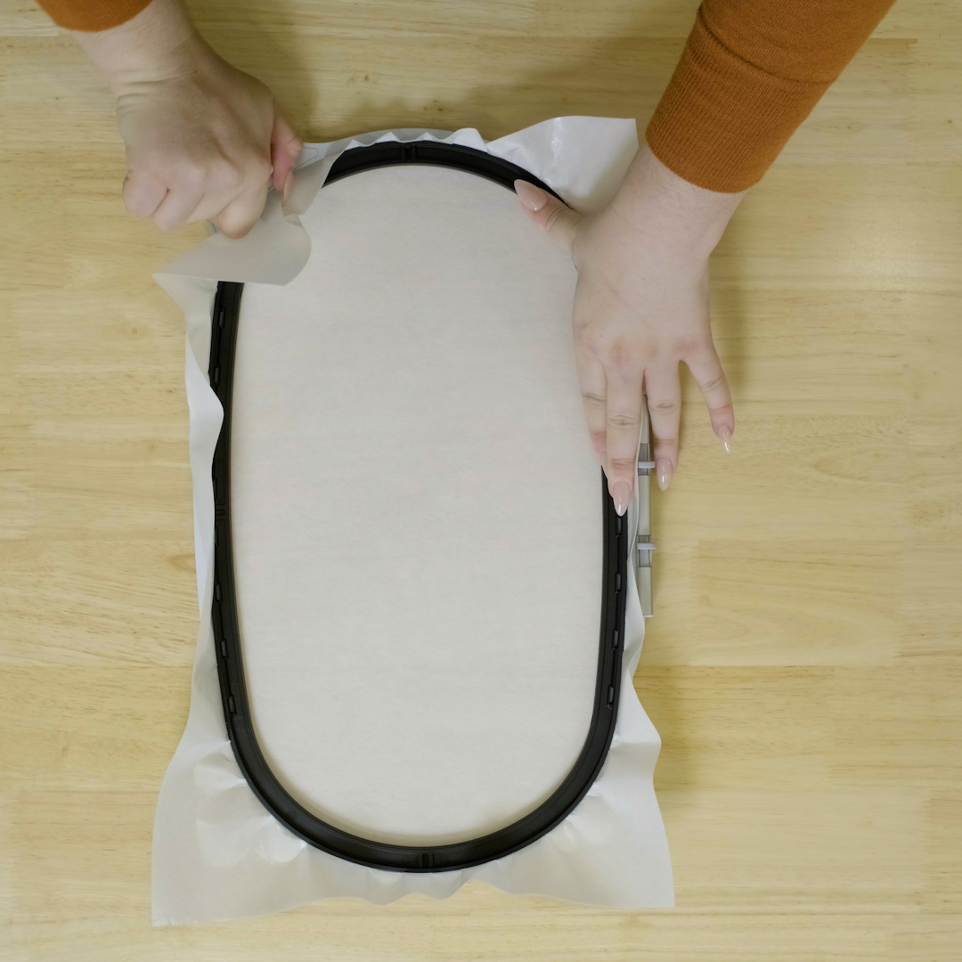 Hoop stabilizer with sticky side up
