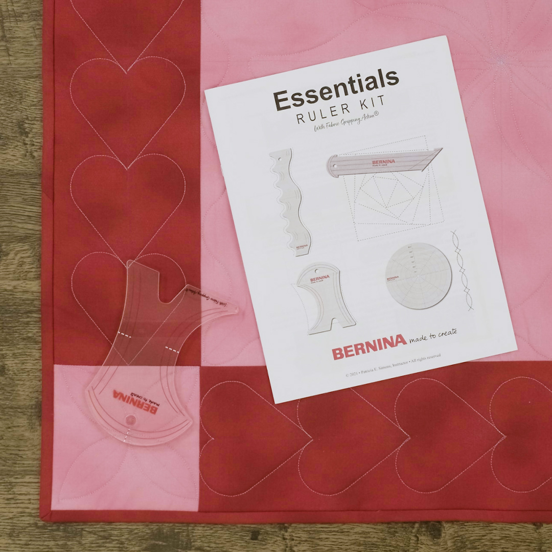 Up-close view of Essential Ruler Kit's instruction manual on top of the BERNINA Multi Curve Guide