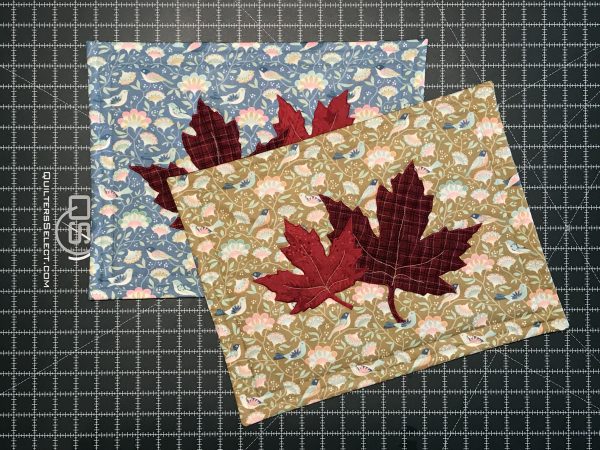 Multi-color fall leaf placemats on grid cutting mat