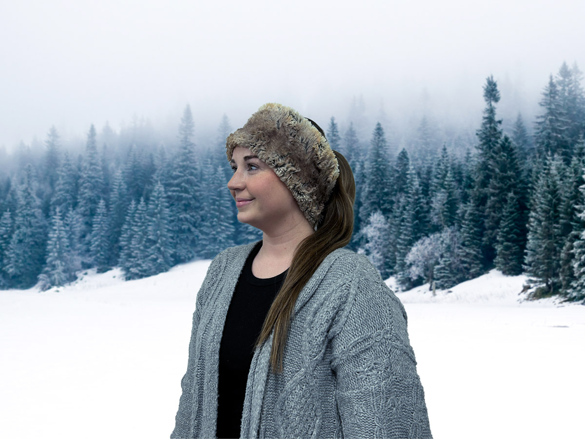 Faux Fur Headband on a brunette modeling in the snow-covered woods