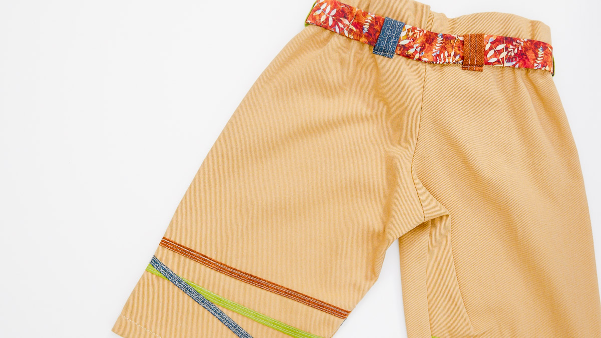 Mustard yellow pants with colorful thread and belt loops