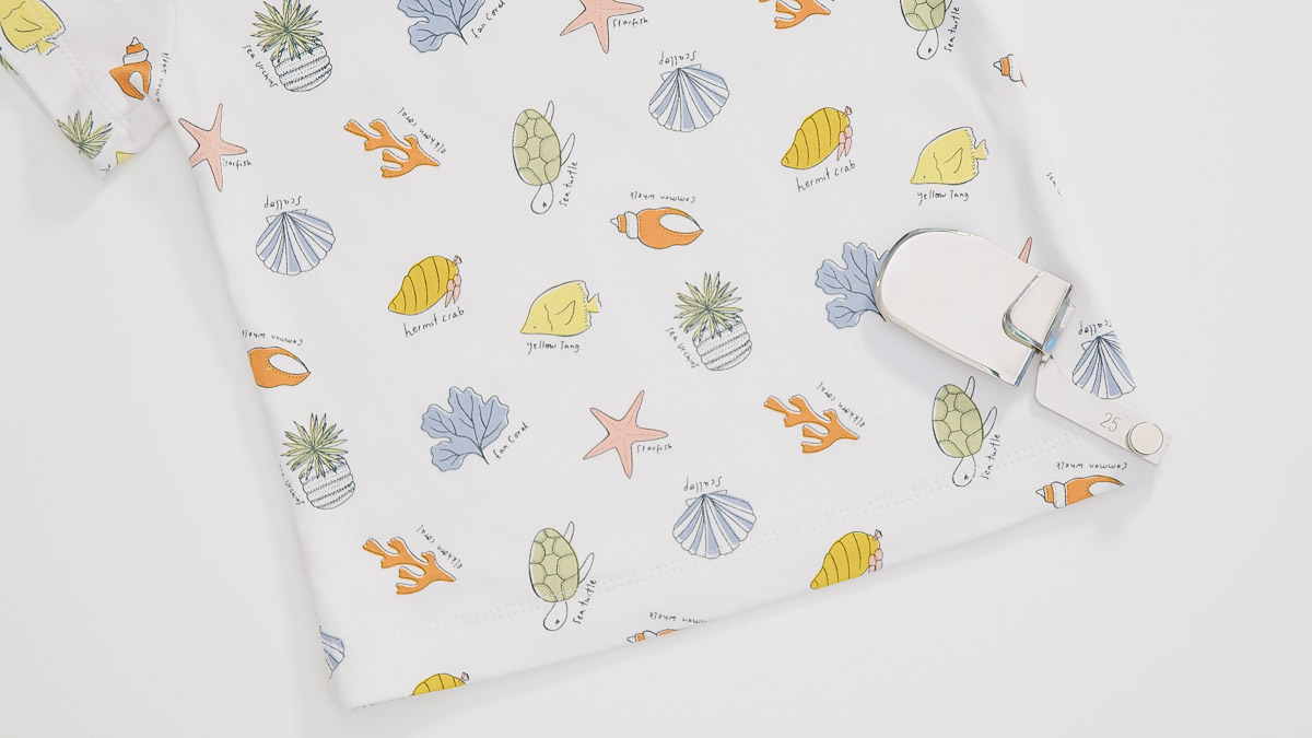 sea-themed blanket on a white table