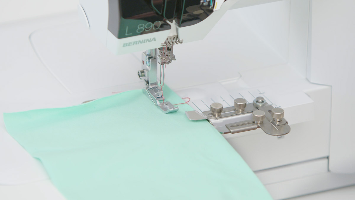 stitching on foam green fabric with the L 890, using the coverstitch hemmer