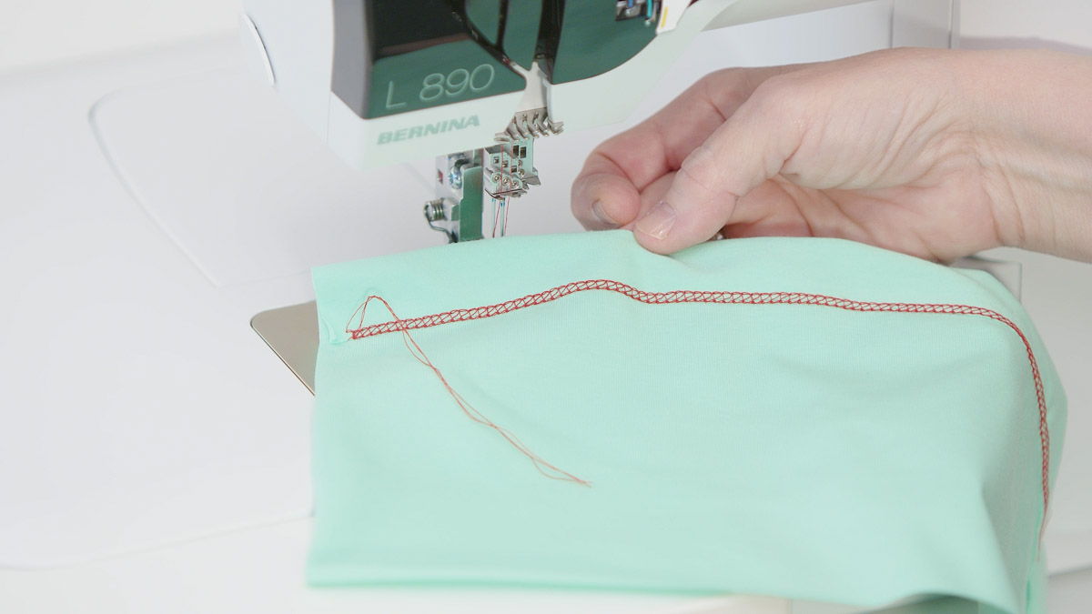 Showing the results of using the hemmer with red thread and foam green fabric