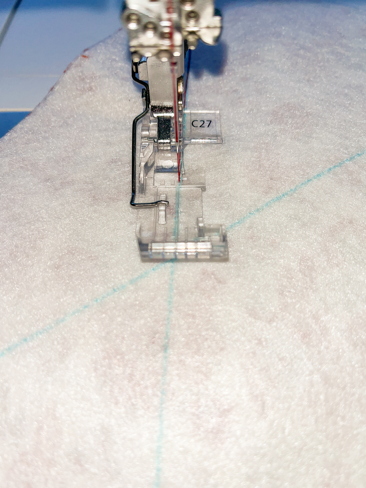 Stitching across white fleece