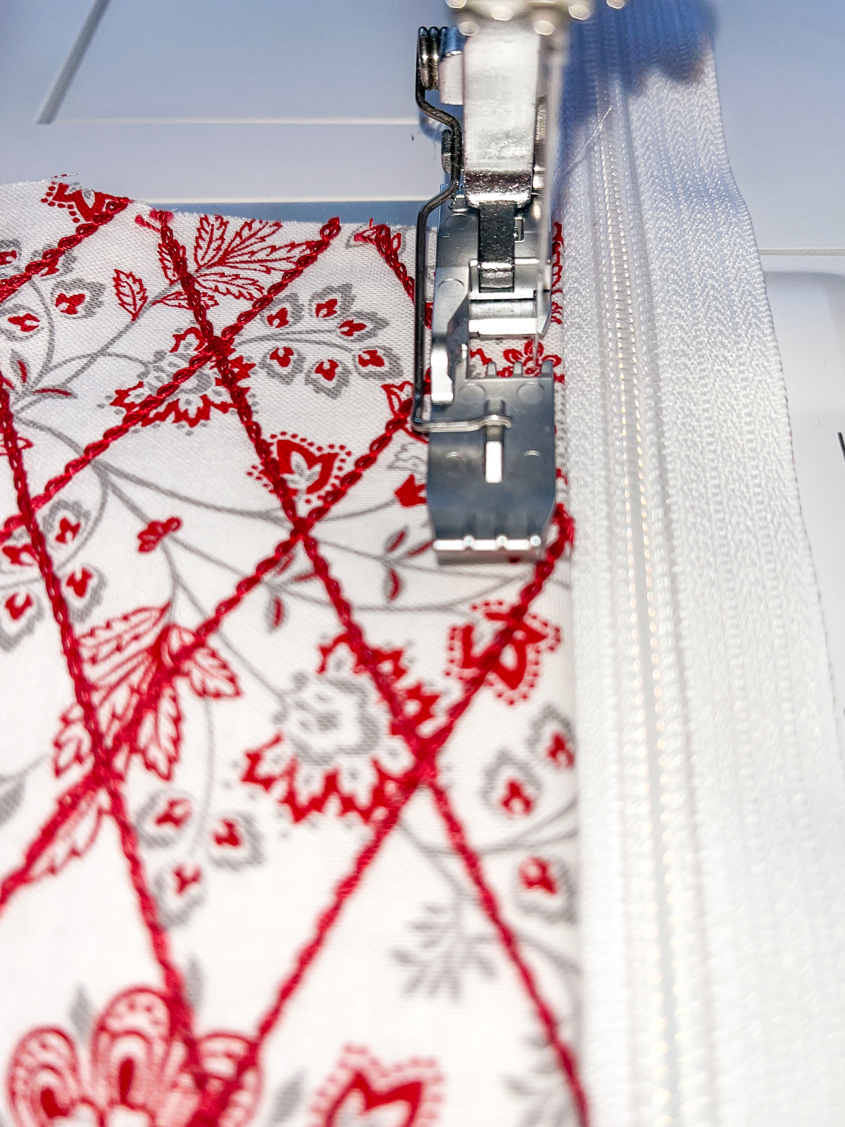 Close-up view of top stitching a zipper in place