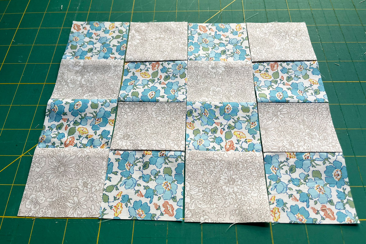 Laying out strip piecing to form the components of a 16 patch quilt block