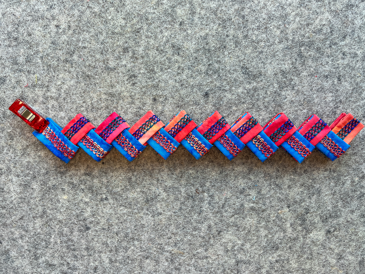 Zigzag pieces coming together to form a bracelet