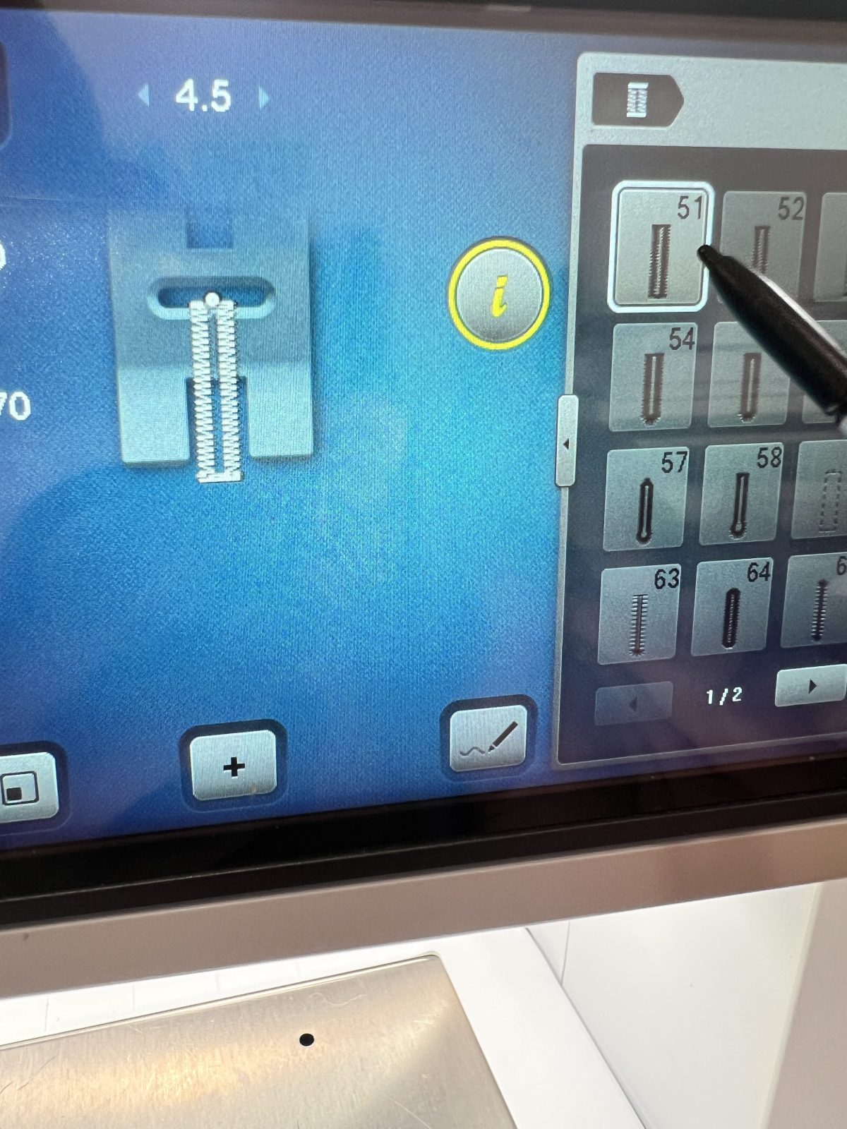 Close up of a BERNINA sewing machine touchscreen showing buttonhole stitch number 51 selected, with a stylus pointing at the option.