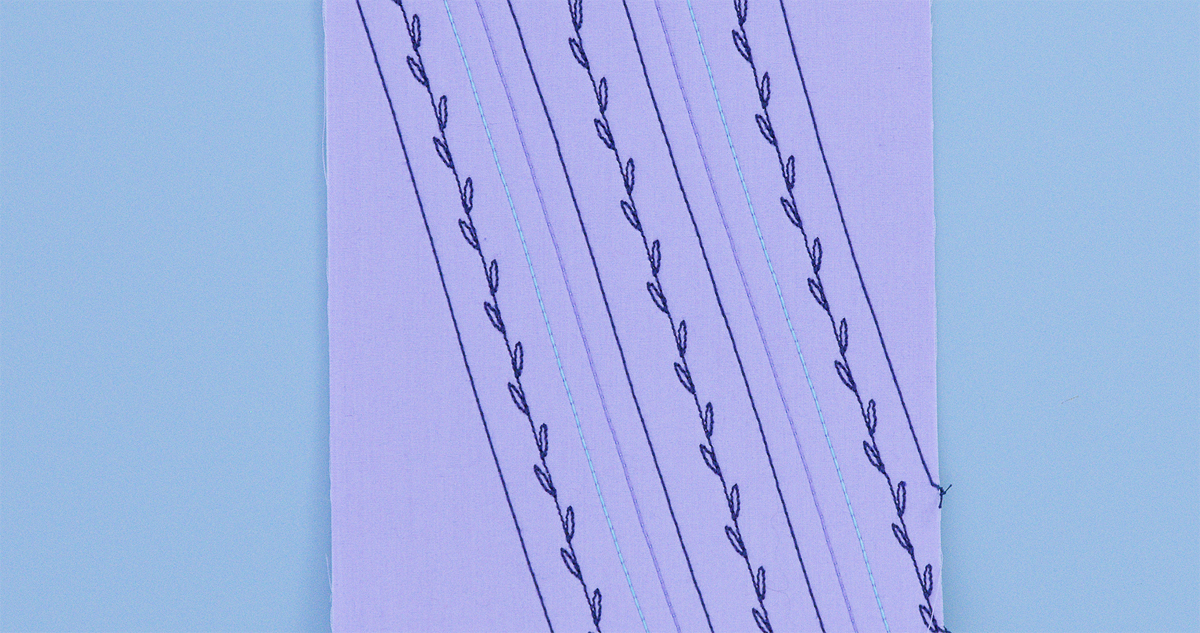Finished purple fabric sample showing multiple rows of decorative leaf-pattern stitching created with Cordonnet thread