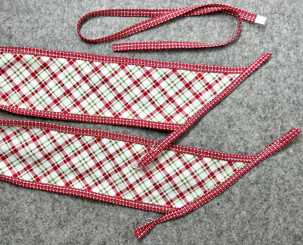 overhead view of the stitched ends with fabric overhanging the edges.