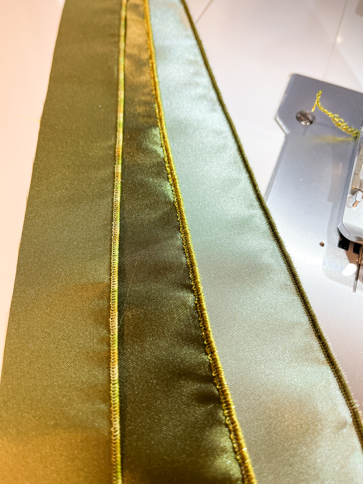 green strips with gold thread