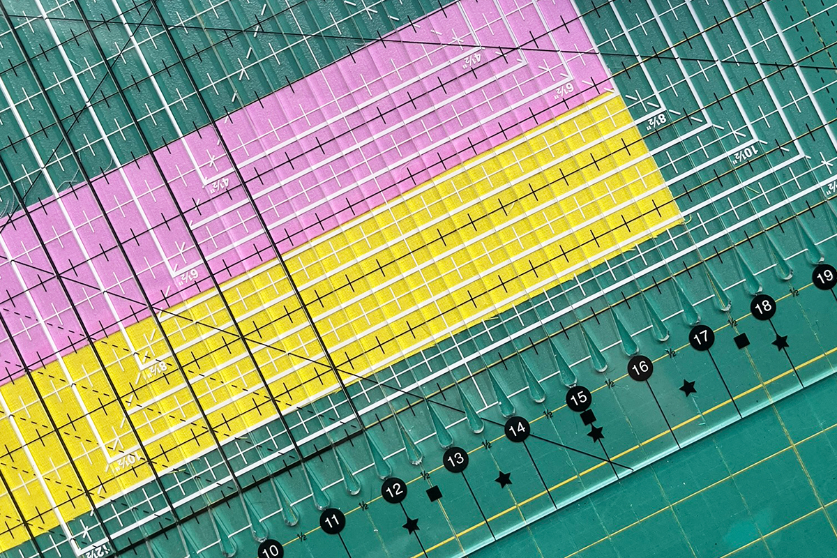A flat lay look at the Creative Grids Stripology Ruler XL.