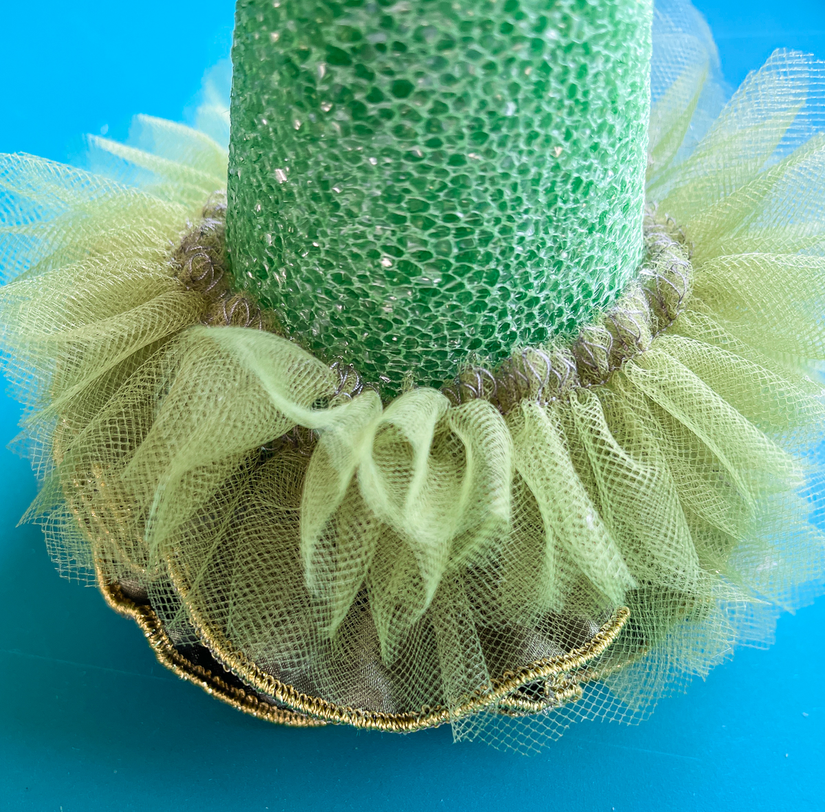 ruffled net around green cone
