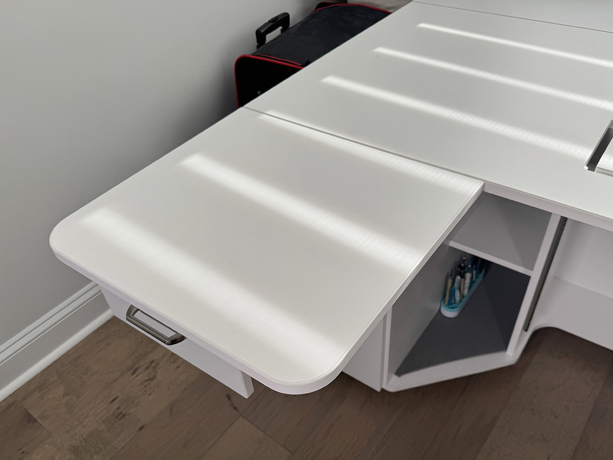 most often I sew with the extension table out, which covers the first top drawer.