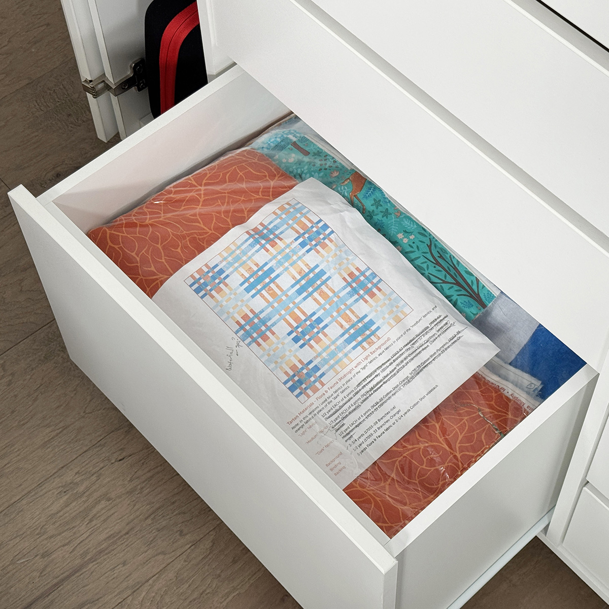 The bottom wide drawer is deep, so it has space for many projects.