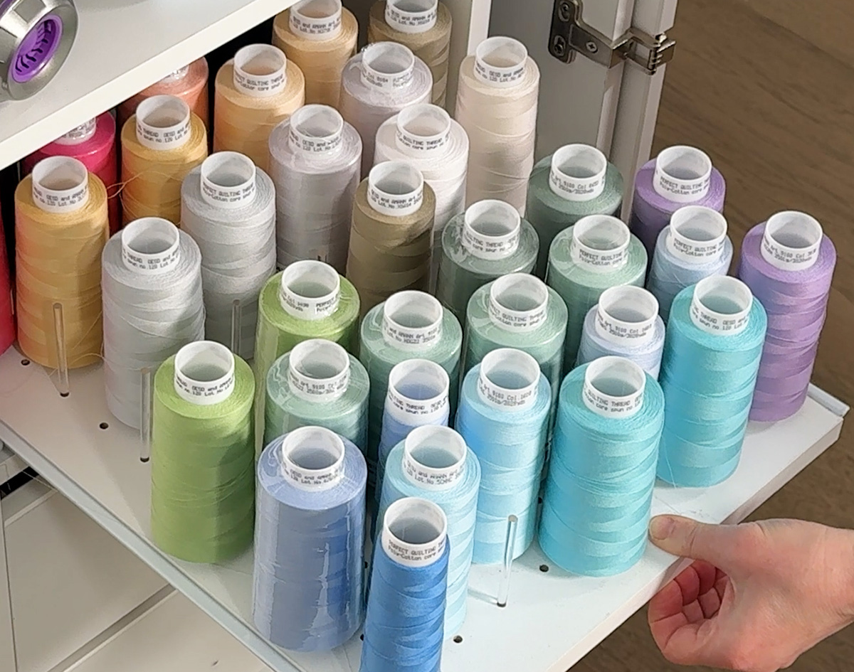Cones of Perfect Quilting Thread are on this shelf.  I'd recommend buying them in pairs - they you don't have to clip your thread to wind additional bobbins.