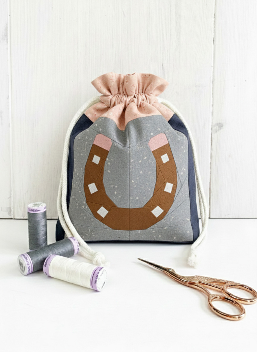 Horseshoe quilt block pattern on a drawstring bag by Joe June and Mae