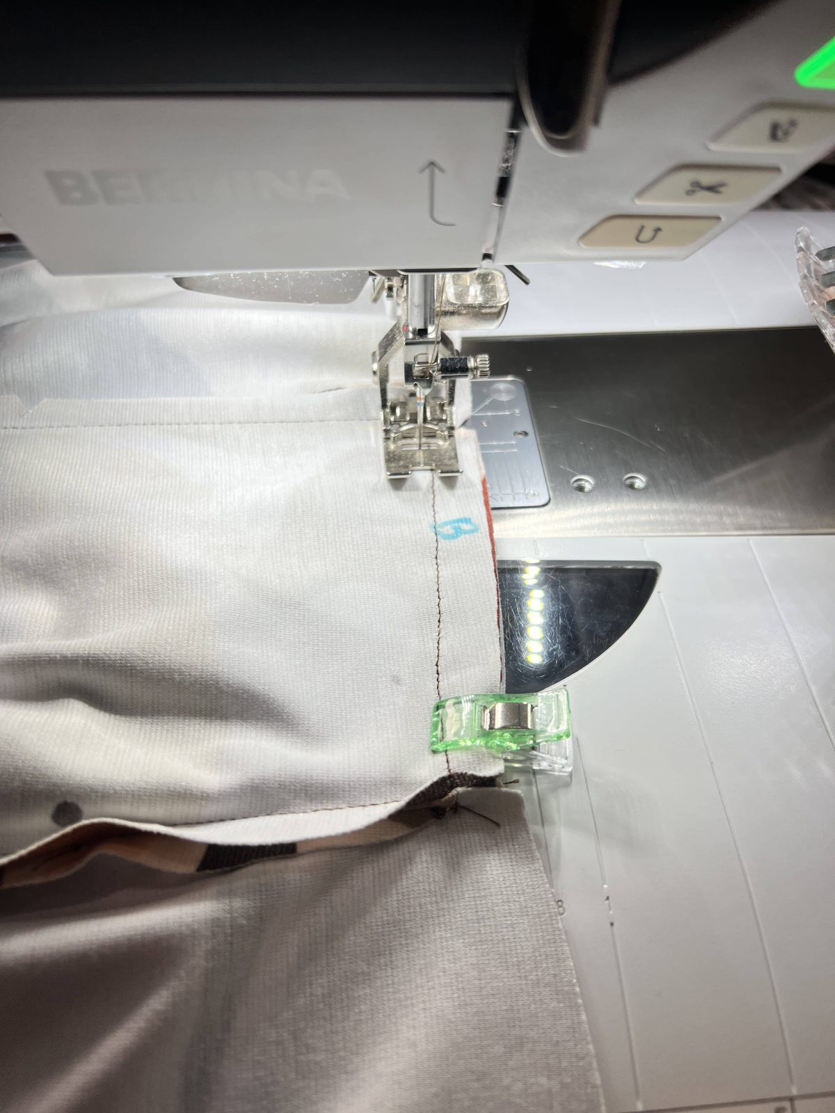 Stitch the top of pocket with wrong sides together to lower waist edge