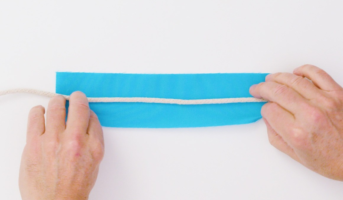 overhead view of heads and cording on blue fabric